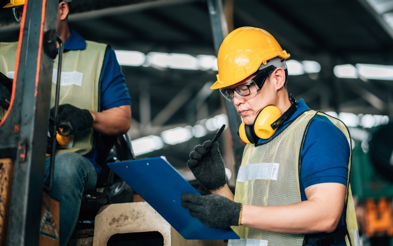 Factory Visit Preparation A buyer reviewing a factory assessment checklist before inspecting manufacturing operations.